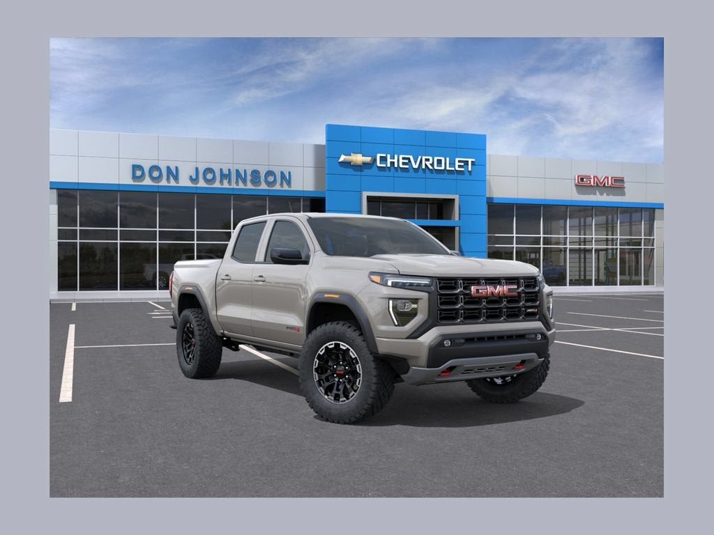 2026 GMC Canyon AT4 in Coastal Dune — front three-quarter view